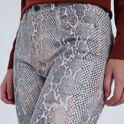 beige coloured pants with snake print