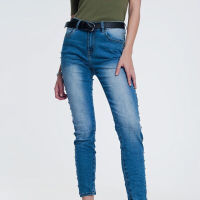 Jeans skinny con borchie in denim stropicciato