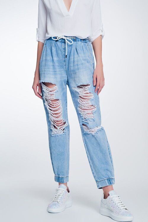 Heavily ripped boyfriend jeans in light denim