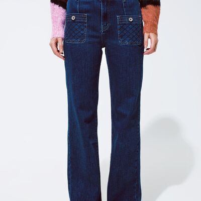 Blue jeans with buttoned pocket details in dark wash