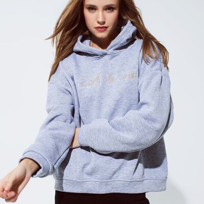 Grey color hoodie with embroidered with Cést La Vie text