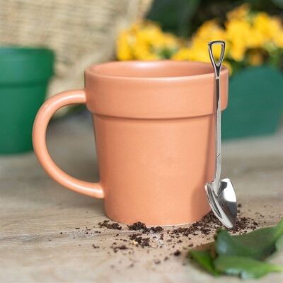 Pot de fleurs uni, tasse en céramique et cuillère à pelle