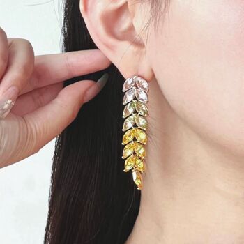 Boucles d'oreilles pendantes longues avec feuilles de zircone rayonnantes : le summum du luxe 5