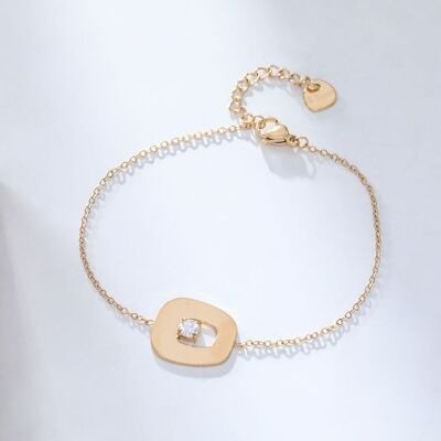 Golden chain bracelet with smooth pendant and rhinestones
