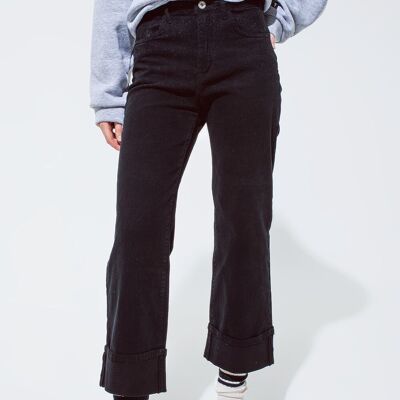 Straight leg jeans in black with folded trouser legs