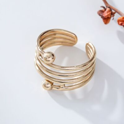 Gold multi line and ball ring