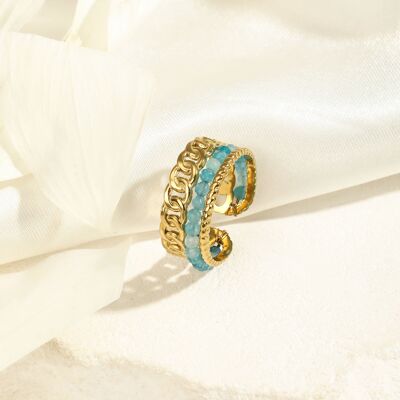 Golden ring with blue stones