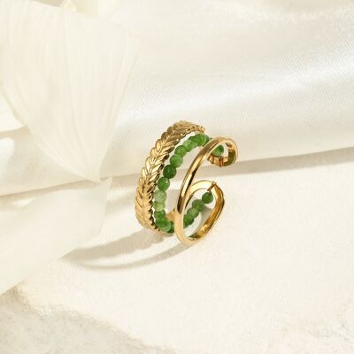 Golden ring with green stones