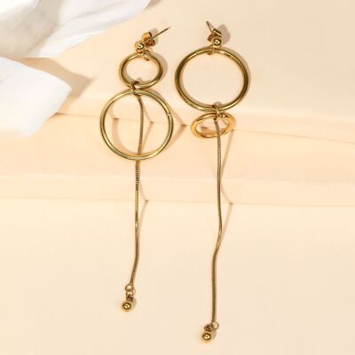 Gold earrings with asymmetrical dangling circles and lines