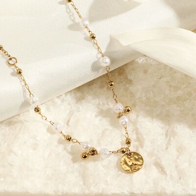 Golden chain necklace with white stones and round hammered pendant