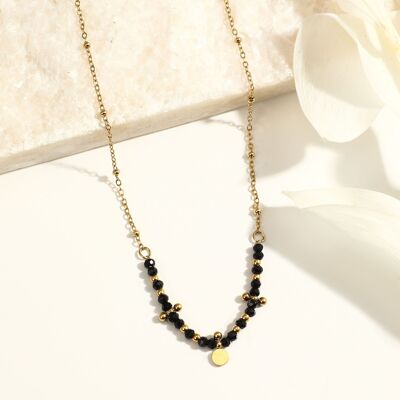 Golden chain necklace with black stones and round pendant