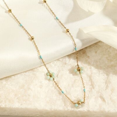 Golden chain necklace with blue color and water green flower