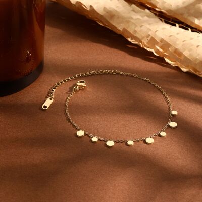 Golden chain bracelet with mini round pendants