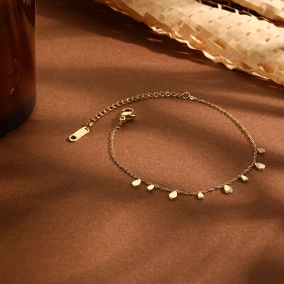 Golden chain bracelet with mini drop pendants