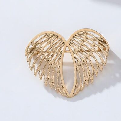 Gold brooch with stainless steel wings