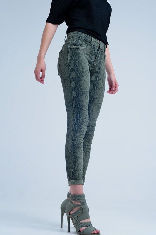 Green skinny reversible jeans with snake print