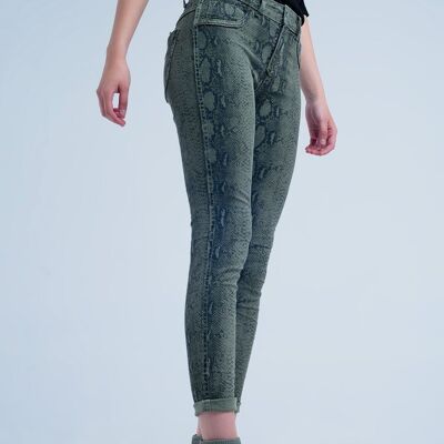 Green skinny reversible jeans with snake print