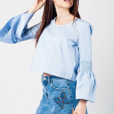 Blue crop top with fluted sleeves