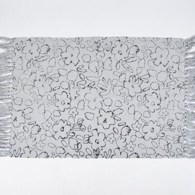 Tapis en coton tissé à la main à imprimé abstrait avec pompons