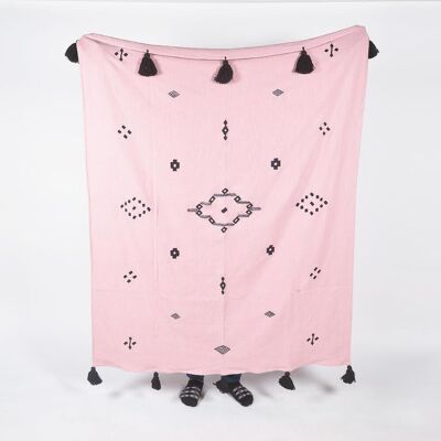 Manta rosa pastel de algodón tejida a mano con borlas