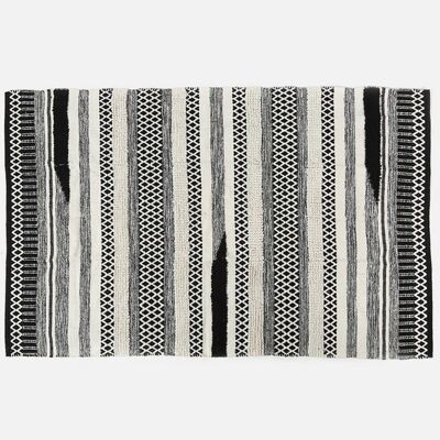 Tappeto strutturato monocromatico tessuto e trapuntato