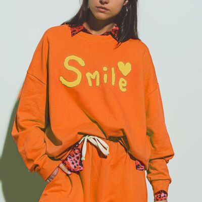 Übergroßes Sweatshirt mit Lächeln-Text in Orange