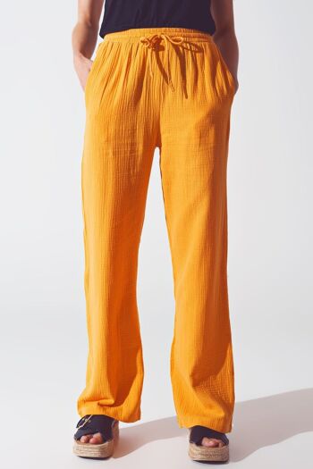 Pantalon coupe ample texturé en orange 1