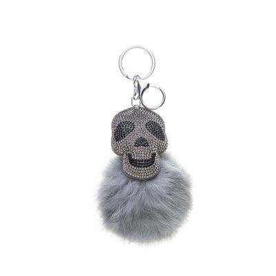 Pendentif tête de mort pompon fourrure