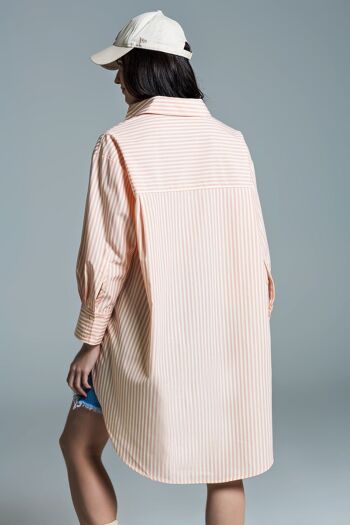 Blouse oversize orange clair à rayures blanches 2