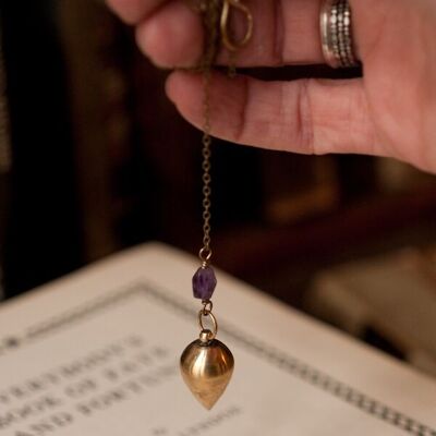 Antique brass pendulum necklace with amethyst.
