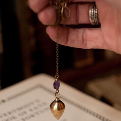 Antique brass pendulum necklace with amethyst.
