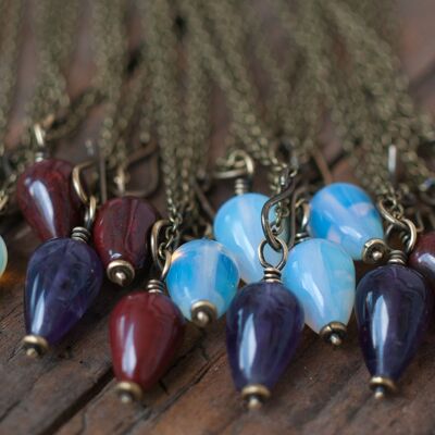 Pendulum necklace, antique brass with various stones.