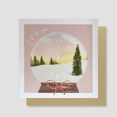 Cartolina di Natale con globo di neve all'alba