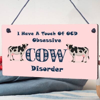 Targa da appendere con scritta "I Have A Touch of OCD Obsessive Cow Disorder".