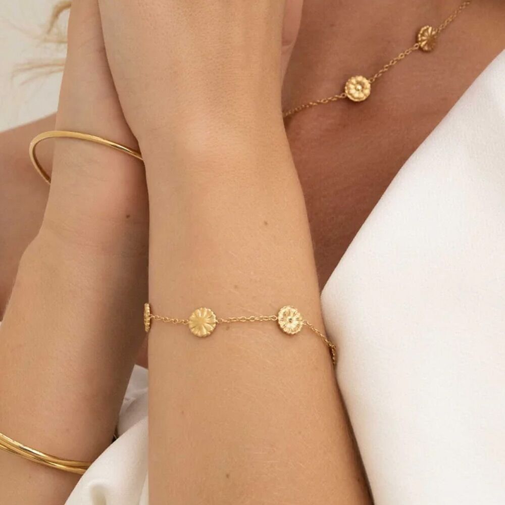 Margeritenarmband – runde Quasten mit Blumen