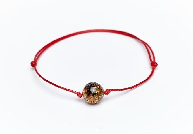 Bracciale in ambra con cordino rosso verde