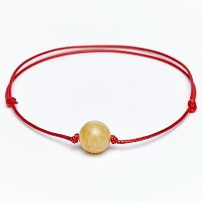Bracelet ambre fil rouge laiteux
