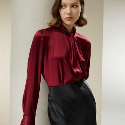 Asymmetrical blouse with embellished pleats