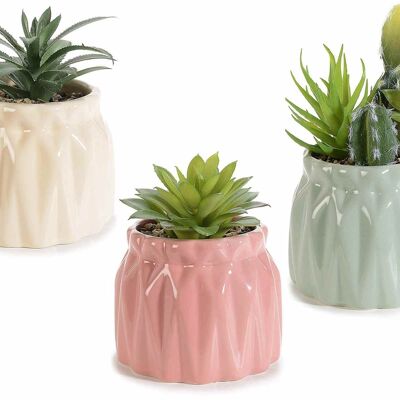 Bunt glänzende Keramiktöpfe mit künstlichen Pflanzen