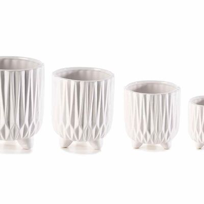 Glossy white ceramic vases with carved decorations in a set of 4 pieces