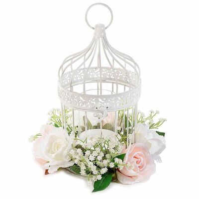 White metal cages with artificial roses and candle vase