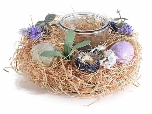 Centrotavola a nido con uova, fiori artificiali e vasetti portacandela in vetro