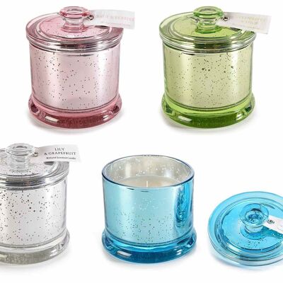 Scented candles in colored glass jar with lid