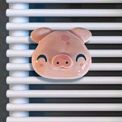 Percha Piggy rosa para radiadores y toalleros