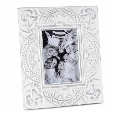Wooden photo holder with relief decorations to place