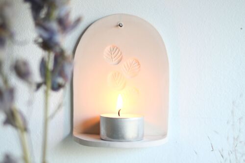 Ceramic wall hanger with candle light