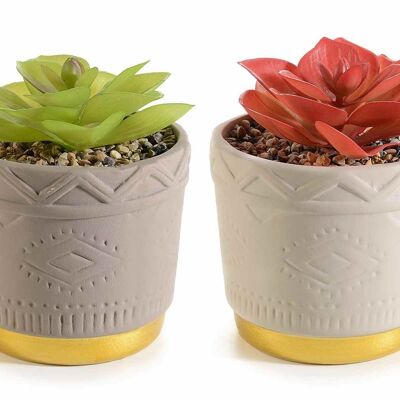 Jarrones de cerámica con base dorada y planta artificial.