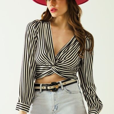 Striped crop top with V-neckline and twisted front in black and white.