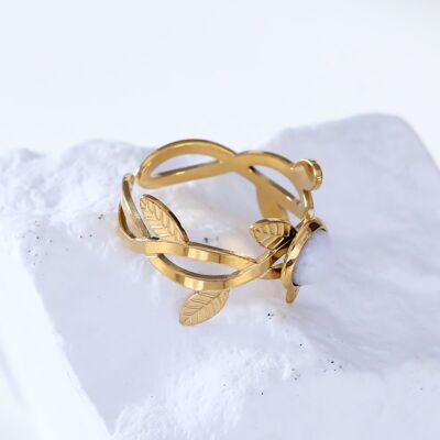 Golden flower ring with white stone