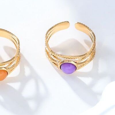 Golden wave ring with purple stone